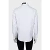 White shirt decorated with embroidery
