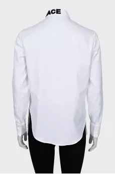 White shirt decorated with embroidery