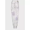 Printed jeans decorated with rhinestones