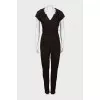 Fitted jumpsuit decorated with chain