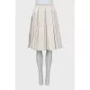 White pleated skirt
