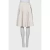 White pleated skirt