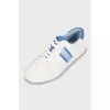 Faux leather sneakers in signature print