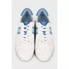 Faux leather sneakers in signature print