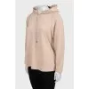 Beige hoodie with raised seams
