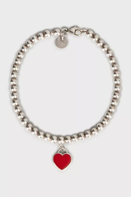 Silver bracelet with heart-shaped pendant