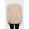 Beige sweater with decorative weave