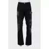 Men's jeans with studs and ripped effect