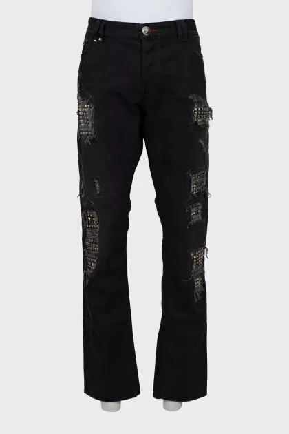 Men's jeans with studs and ripped effect