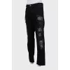 Men's jeans with studs and ripped effect