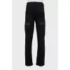 Men's jeans with studs and ripped effect