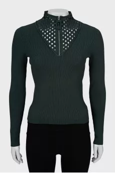 Green jumper with perforations