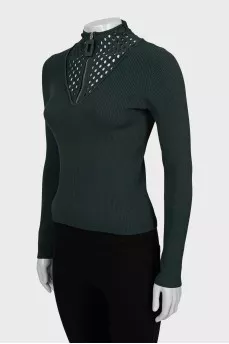 Green jumper with perforations