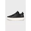 Leather sneakers with metal logo