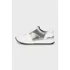 Sneakers with signature print and tag