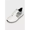 Sneakers with signature print and tag