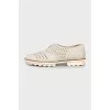 Perforated suede shoes