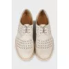 Perforated suede shoes