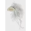 Brooch decorated with feather