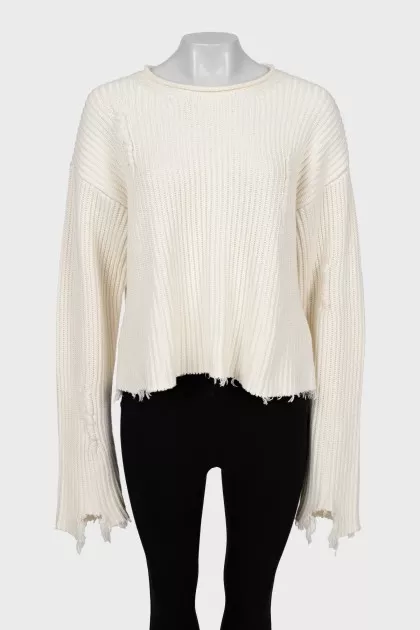 Knitted sweater with ripped effect