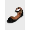 Suede sandals with twist closure