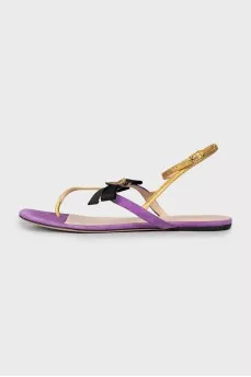 Leather sandals decorated with a bow