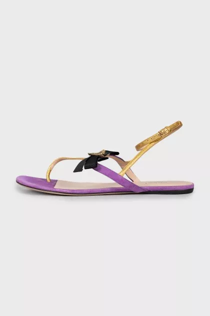 Leather sandals decorated with a bow