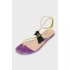 Leather sandals decorated with a bow