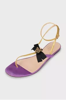 Leather sandals decorated with a bow