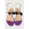 Leather sandals decorated with a bow