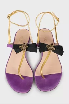 Leather sandals decorated with a bow