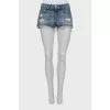 Distressed denim shorts