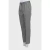 Trousers with arrows in fine print
