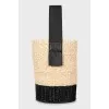 Woven bucket bag with tag