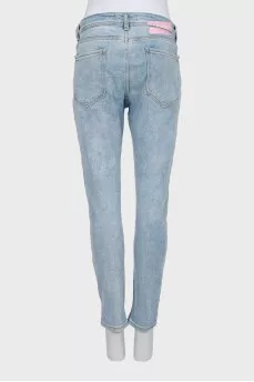 Light blue distressed skinny jeans