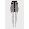 Mini skirt with silver buttons