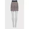 Mini skirt with silver buttons