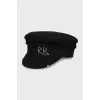 Wool cap with golden decoration