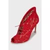 Red shoes with floral embroidery