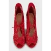 Red shoes with floral embroidery