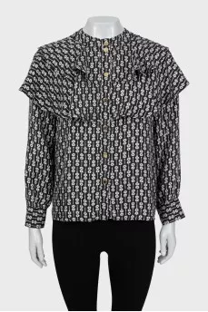 Black and white printed blouse with ruffles