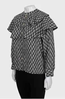 Black and white printed blouse with ruffles