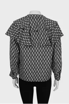Black and white printed blouse with ruffles