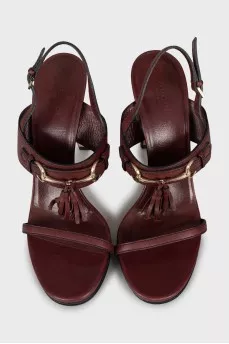 Leather sandals decorated with tassels