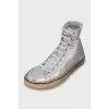 Silver leather sneakers with tag