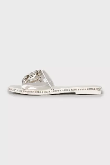 White flip flops with tag
