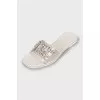 White flip flops with tag