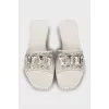 White flip flops with tag