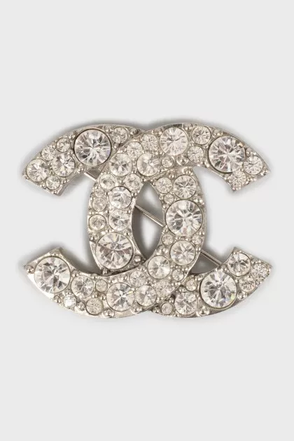 Logo brooch with rhinestones