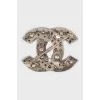 Logo brooch with rhinestones